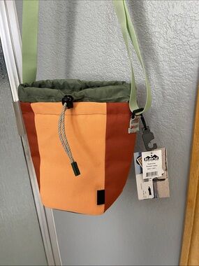 Kavu Orange, Rust & Olive Drawstring Sling Bag with Green Strap